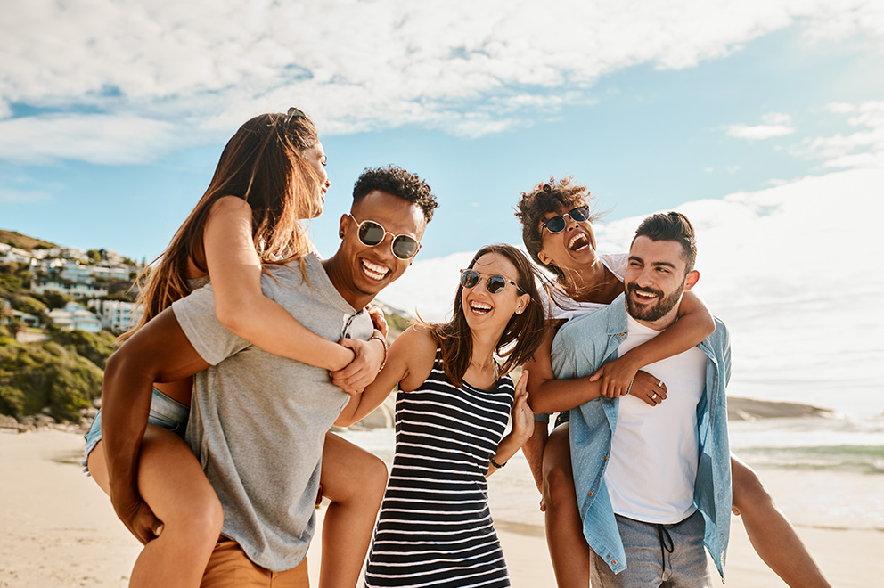 Friends happy on the beach