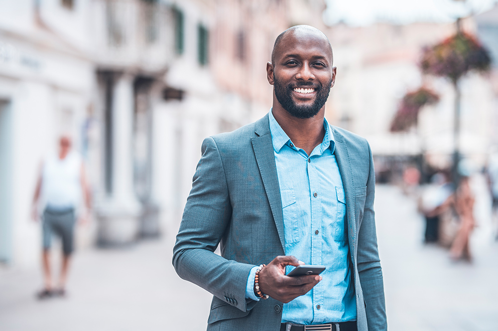 Man smiling with smartphone