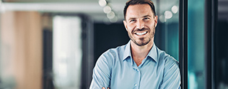 Man smiling in office