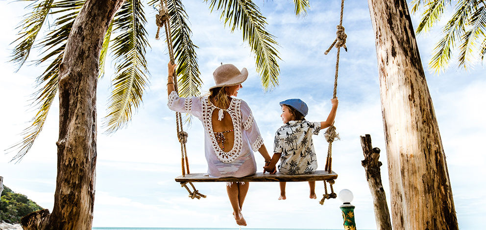 Mother and son relaxing at the beach