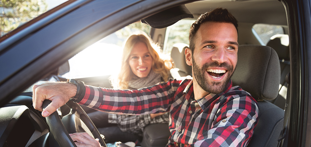 Couple smiling in car