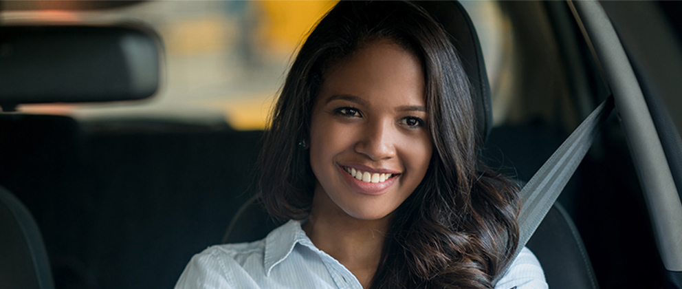 Woman smiling in car