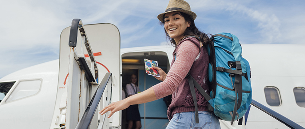 woman getting on airplane