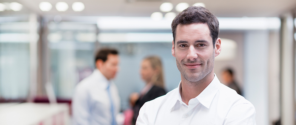 man smiling in office